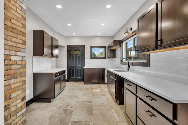 212 S Columbia Ave, Oglesby, IL 61348 - kitchen featuring dark brown cabinets, backsplash, recessed lighting, and light countertops