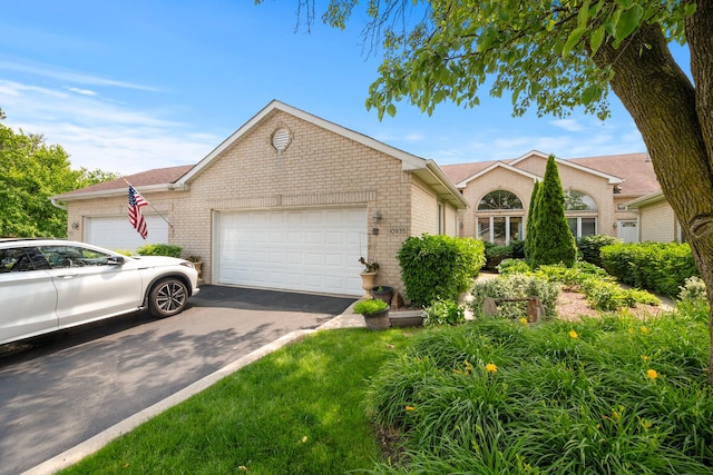10935 Conifer Ct, Orland Park, IL 60467 - ranch-style house featuring brick siding, a garage, and driveway