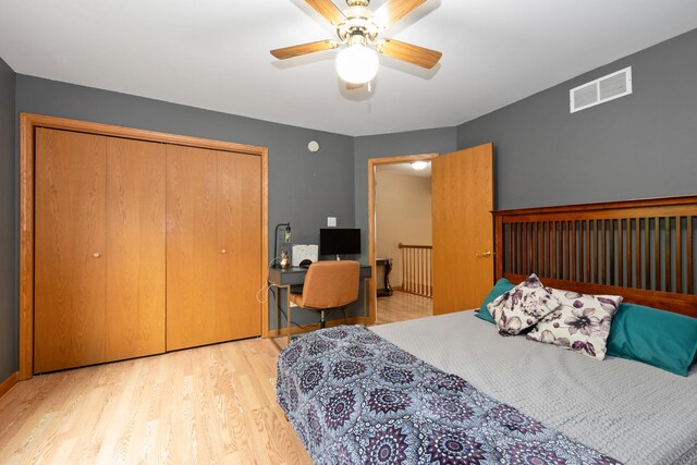 10935 Conifer Ct, Orland Park, IL 60467 - bedroom with a closet, wood finished floors, ceiling fan, and an office area