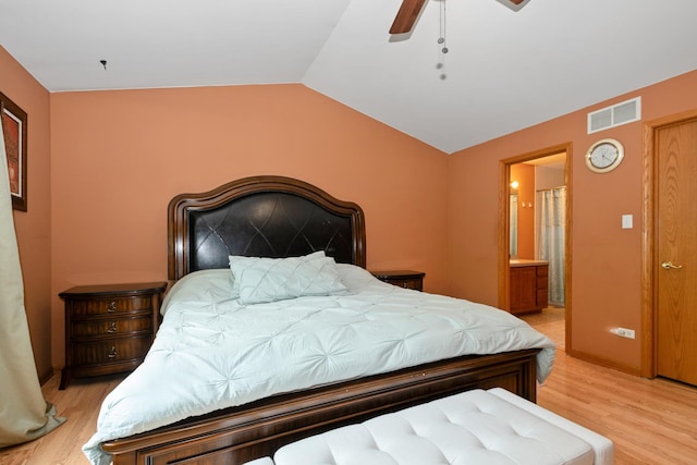 10935 Conifer Ct, Orland Park, IL 60467 - bedroom featuring light wood finished floors, vaulted ceiling, ensuite bath, and a ceiling fan