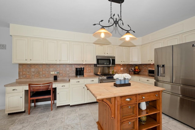 10935 Conifer Ct, Orland Park, IL 60467 - kitchen with stainless steel appliances, tasteful backsplash, hanging light fixtures, a center island, and wood counters