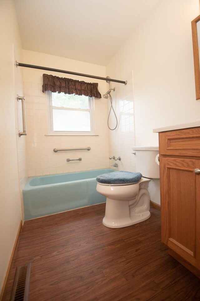 1602 N Jefferson Ave, Dixon, IL 61021 - bathroom featuring shower / tub combination, vanity, and wood finished floors