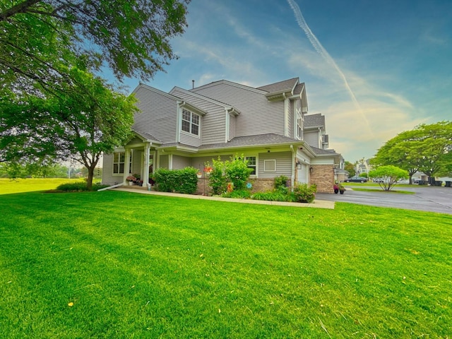 3944 Garnette Ct, Naperville, IL 60564 - view of front of house with driveway, a front yard, and brick siding