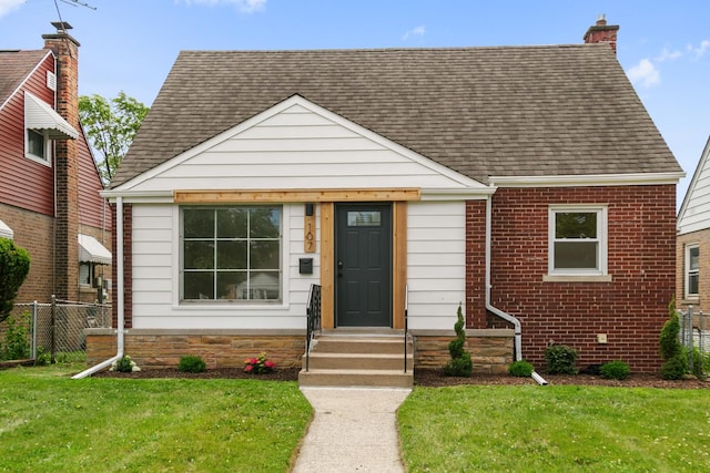 107 163rd St, Calumet City, IL 60409 - bungalow with roof with shingles, a chimney, and brick siding