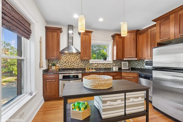 5359 N Paulina St Unit 2, Chicago, IL 60640 - kitchen with stainless steel appliances, wall chimney exhaust hood, dark countertops, and tasteful backsplash