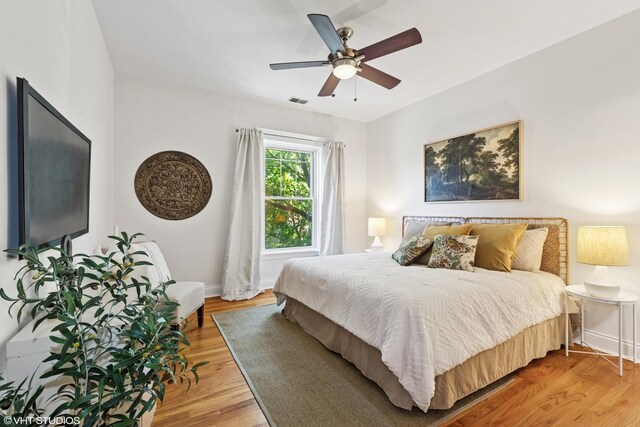5359 N Paulina St Unit 2, Chicago, IL 60640 - bedroom with light wood finished floors and ceiling fan