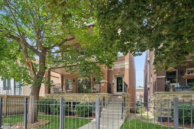 4110 N California Ave Unit 1, Chicago, IL 60618 - view of property hidden behind natural elements with brick siding, a fenced front yard, and stairway