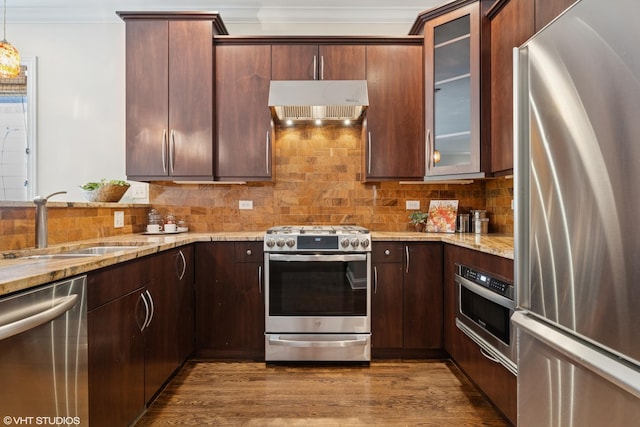 4110 N California Ave Unit 1, Chicago, IL 60618 - kitchen featuring appliances with stainless steel finishes, extractor fan, ornamental molding, backsplash, and glass insert cabinets