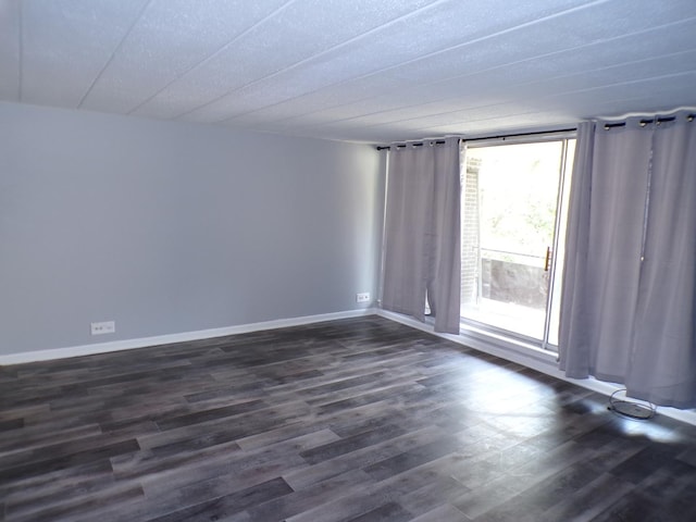 12548 Fairview Ave Unit 2B, Blue Island, IL 60406 - unfurnished room with dark wood-style flooring and baseboards