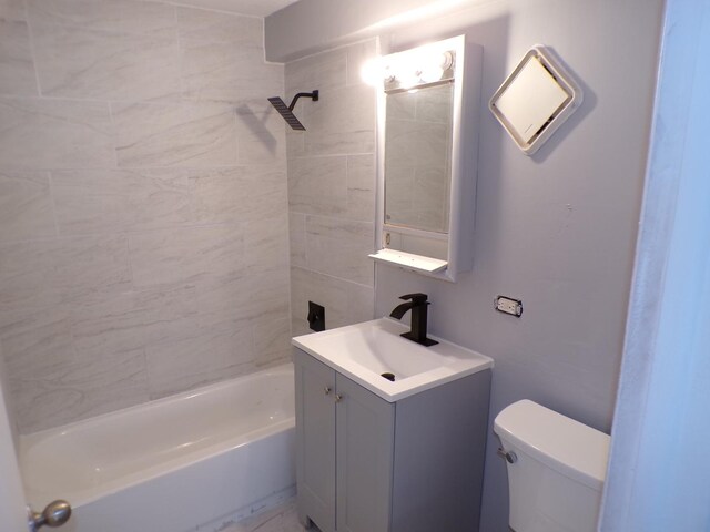 12548 Fairview Ave Unit 2B, Blue Island, IL 60406 - bathroom featuring toilet, vanity, and bathtub / shower combination