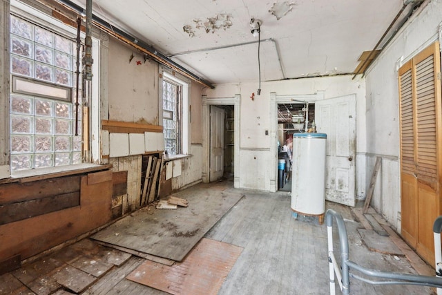 3444 S Western Ave, Chicago, IL 60608 - misc room featuring water heater and wood finished floors