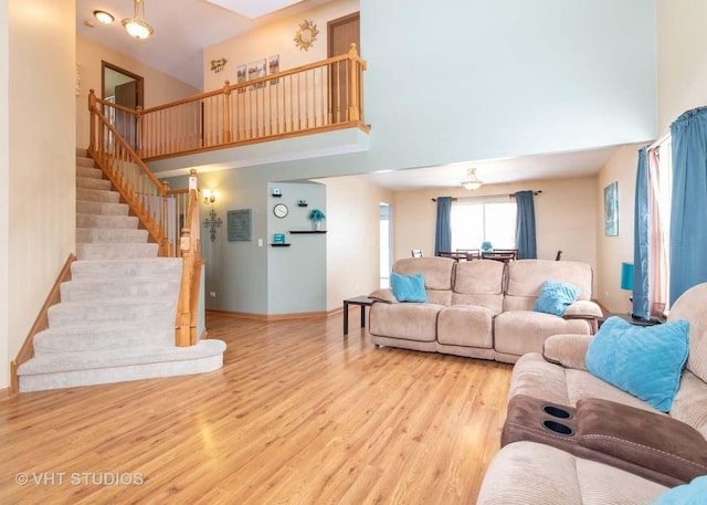 26149 S Locust Pl, Monee, IL 60449 - living area featuring a towering ceiling, stairway, and wood finished floors