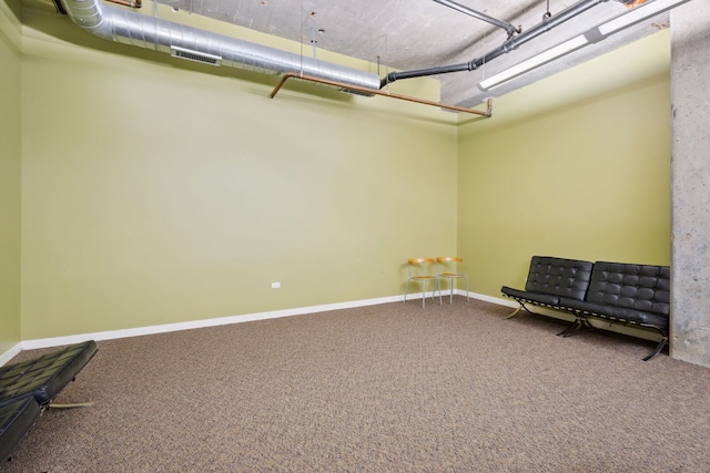 3963 W Belmont Ave Unit 137, Chicago, IL 60618 - below grade area featuring carpet and baseboards
