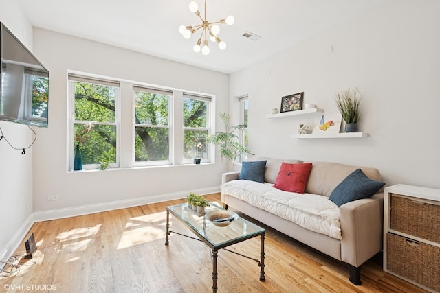 3414 N Racine Ave Unit 2, Chicago, IL 60657 - living room featuring a chandelier and wood finished floors