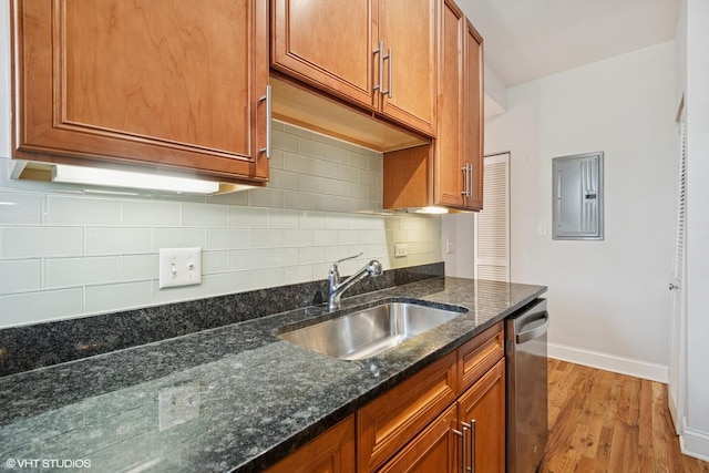 3414 N Racine Ave Unit 2, Chicago, IL 60657 - kitchen featuring stainless steel dishwasher, brown cabinets, light wood-type flooring, and electric panel