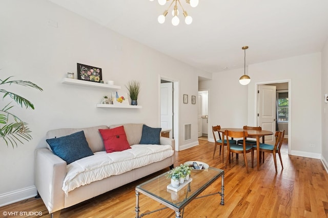 3414 N Racine Ave Unit 2, Chicago, IL 60657 - living room featuring a chandelier and light wood finished floors