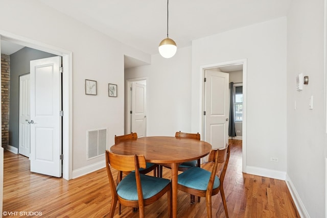 3414 N Racine Ave Unit 2, Chicago, IL 60657 - dining room with light wood-style flooring and baseboards