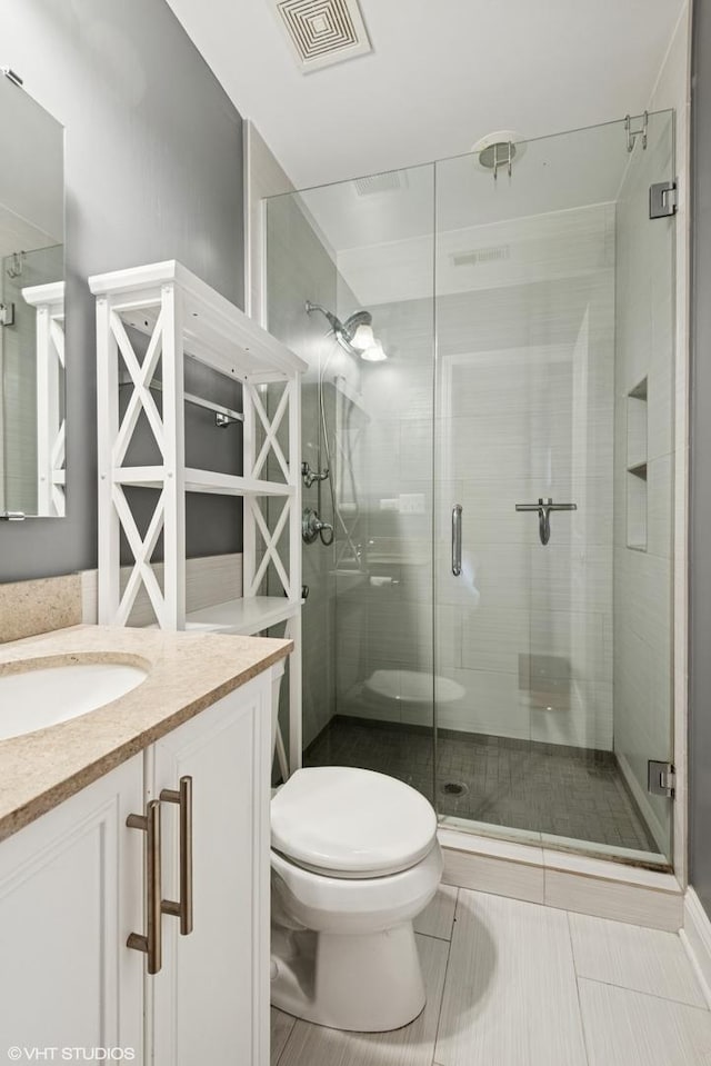 3414 N Racine Ave Unit 2, Chicago, IL 60657 - bathroom with vanity, a stall shower, and tile patterned floors