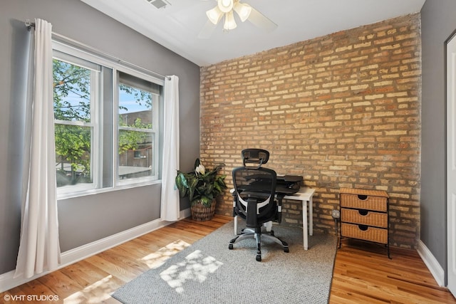 3414 N Racine Ave Unit 2, Chicago, IL 60657 - office space featuring wood finished floors, a ceiling fan, and brick wall