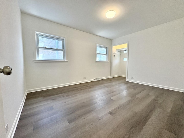 4937 S Kilpatrick Ave, Chicago, IL 60632 - spare room with dark wood finished floors and baseboards