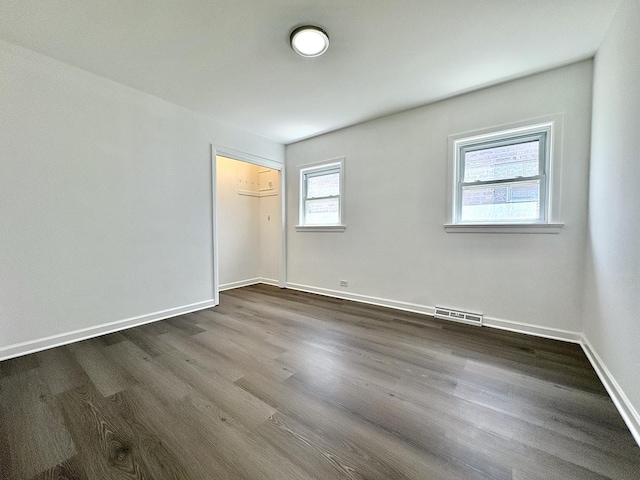 4937 S Kilpatrick Ave, Chicago, IL 60632 - unfurnished room featuring dark wood-type flooring and baseboards