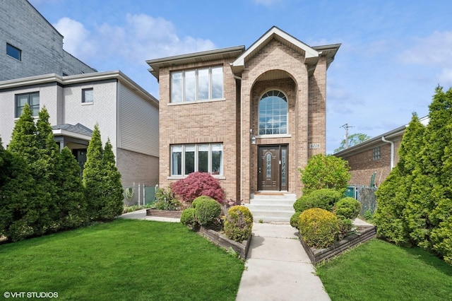 4218 N California Ave, Chicago, IL 60618 - traditional-style home with brick siding and a front lawn