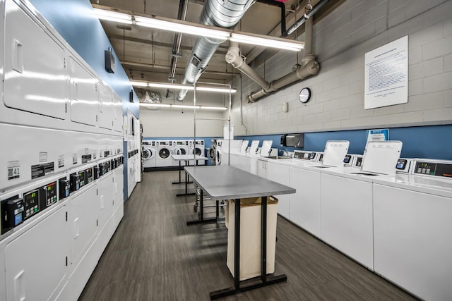 1360 N Sandburg Ter Unit 703C, Chicago, IL 60610 - shared laundry with stacked washer / drying machine, dark wood-style floors, and washer and clothes dryer