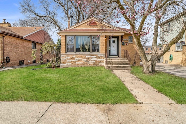 10026 Spaulding Ave, Evergreen Park, IL 60805 - view of front of house with a front yard, stone siding, and brick siding
