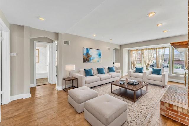10026 Spaulding Ave, Evergreen Park, IL 60805 - living area featuring baseboards, light wood finished floors, arched walkways, and recessed lighting