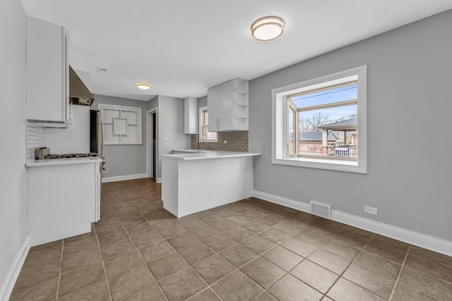 10026 Spaulding Ave, Evergreen Park, IL 60805 - kitchen featuring open shelves, range hood, tile patterned floors, decorative backsplash, and a peninsula