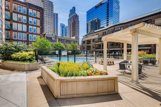 1101 S State St Unit 1805, Chicago, IL 60605 - view of community featuring a pergola, a pool, and a view of skyline