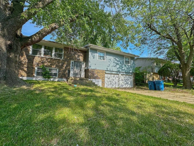 21729 Gailine Ave, Sauk Village, IL 60411 - bi-level home featuring brick siding, an attached garage, a front lawn, and driveway