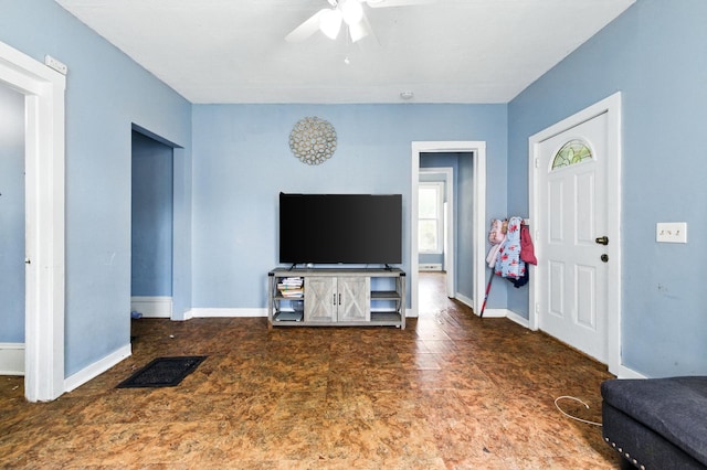 650 Pennsylvania Ave, Aurora, IL 60506 - living area featuring a ceiling fan and baseboards