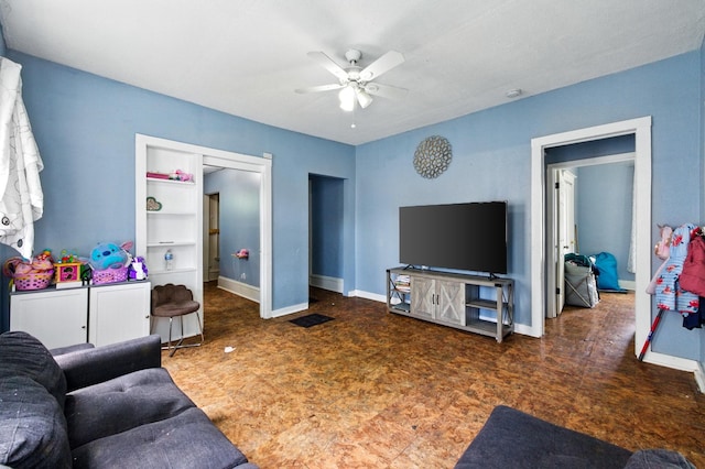 650 Pennsylvania Ave, Aurora, IL 60506 - living area with carpet, a ceiling fan, and baseboards