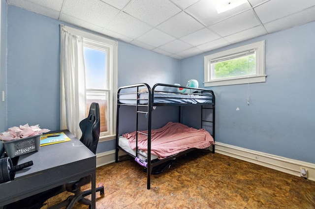 650 Pennsylvania Ave, Aurora, IL 60506 - bedroom with a paneled ceiling, baseboards, and an office area