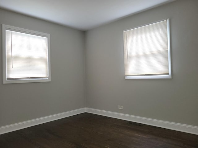 319 Hillandale St, Round Lake, IL 60073 - empty room featuring dark wood finished floors and baseboards