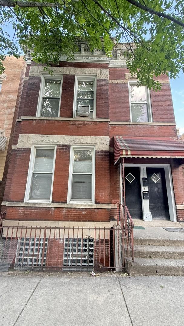 2816 S Lowe St, Chicago, IL 60616 - view of front of property featuring brick siding and cooling unit
