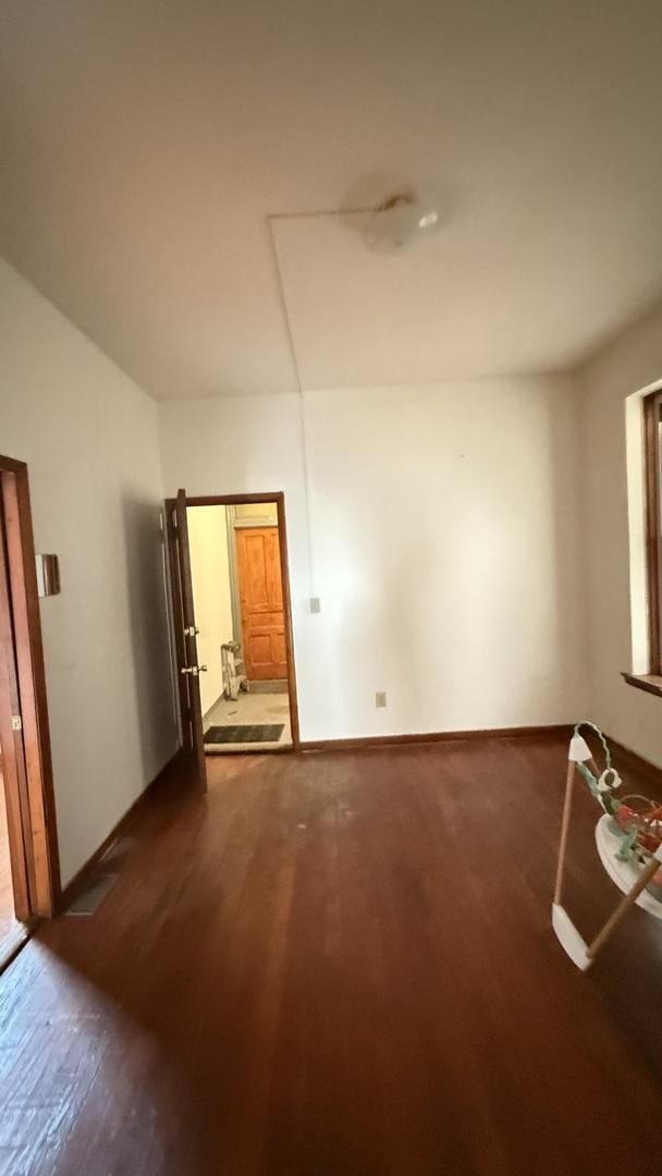 2816 S Lowe St, Chicago, IL 60616 - spare room with wood finished floors and baseboards