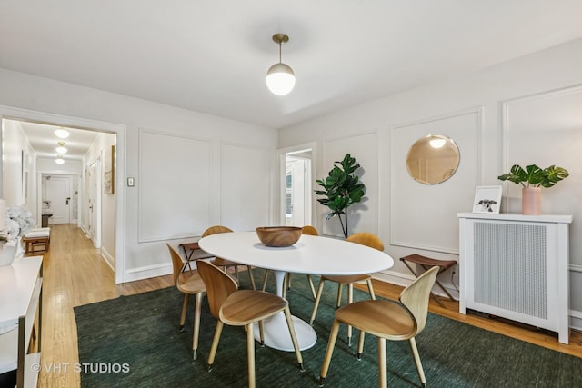 542 Michigan Ave Unit 1, Evanston, IL 60202 - dining room featuring light wood-style flooring and a decorative wall