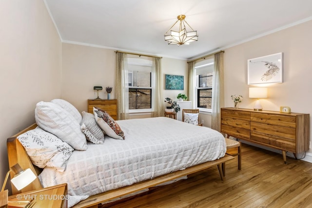 542 Michigan Ave Unit 1, Evanston, IL 60202 - bedroom featuring crown molding and wood finished floors