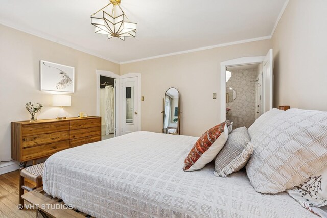 542 Michigan Ave Unit 1, Evanston, IL 60202 - bedroom featuring wood finished floors and crown molding