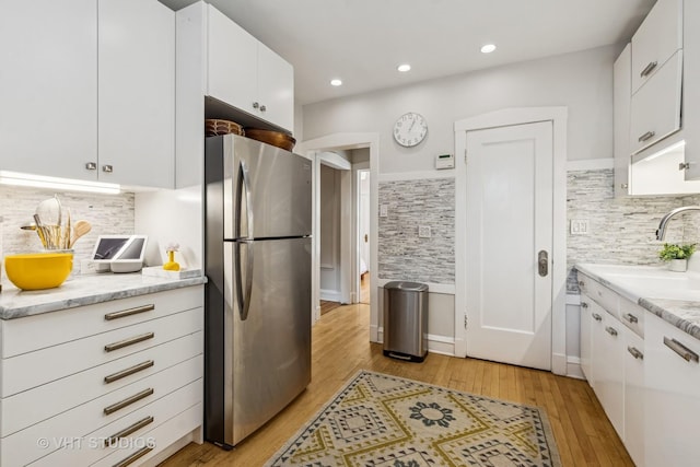 542 Michigan Ave Unit 1, Evanston, IL 60202 - kitchen with freestanding refrigerator, decorative backsplash, light wood-style flooring, white cabinetry, and recessed lighting