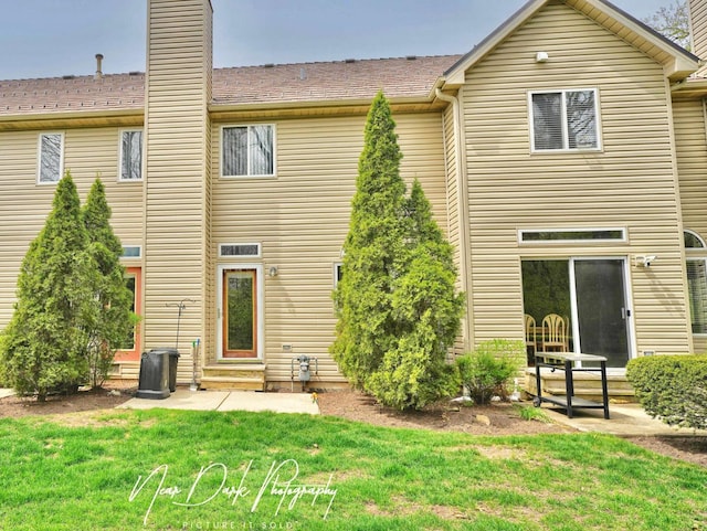 34251 N Homestead Rd, Gurnee, IL 60031 - back of property featuring a yard, a chimney, a patio area, and entry steps