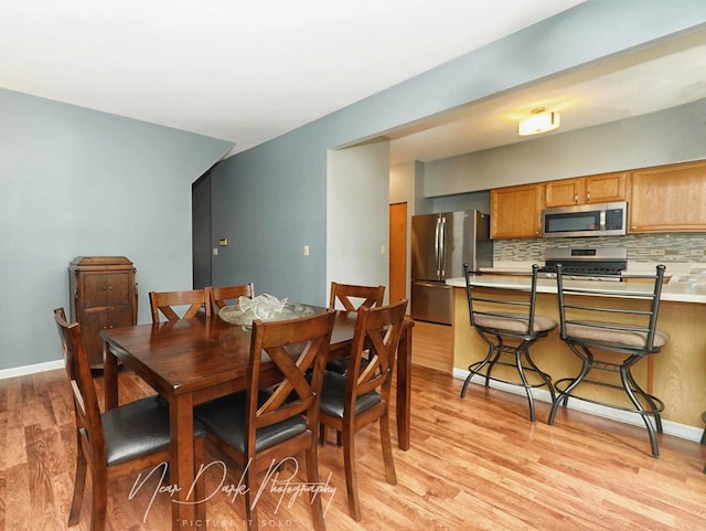 34251 N Homestead Rd, Gurnee, IL 60031 - dining area with light wood-style flooring and baseboards