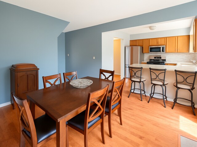 34251 N Homestead Rd, Gurnee, IL 60031 - dining room featuring light wood finished floors and baseboards