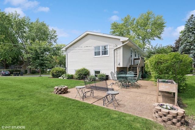 505 Crest Dr, Cary, IL 60013 - rear view of property with a fire pit, a lawn, and a patio