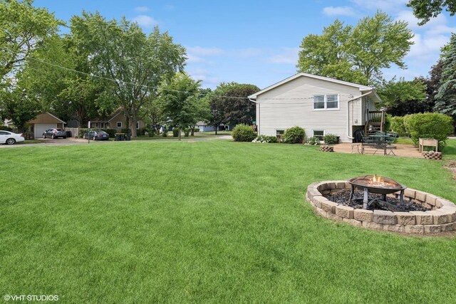 505 Crest Dr, Cary, IL 60013 - view of green lawn featuring a fire pit