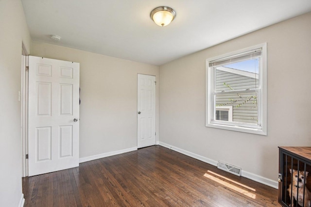17852 Walter St, Lansing, IL 60438 - unfurnished bedroom with dark wood-style flooring and baseboards