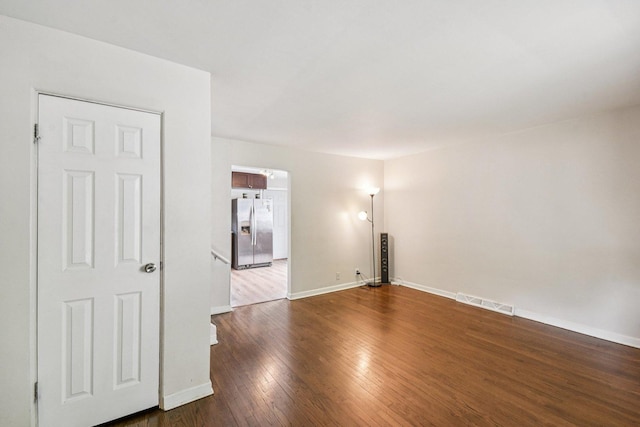 17852 Walter St, Lansing, IL 60438 - unfurnished room with dark wood-style flooring and baseboards