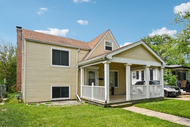 17852 Walter St, Lansing, IL 60438 - view of front facade with a porch, a front yard, a chimney, and roof with shingles